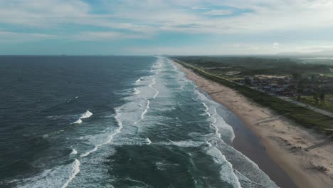 Bird's-eye-view-of-a-beach-with-a-vast-expanse,-on-a-beautiful-summer-day-in-Brazil