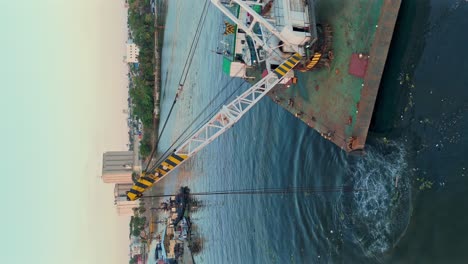 Dredging-the-inland-river-channel-of-the-Ozama-River-with-a-crane