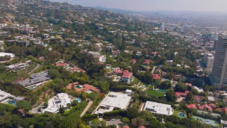 Aerial-Flight-Over-Beverly-Hills-and-West-Hollywood-on-Sunny-Day,-Pools-and-Luxury-Trousdale-Estates-Homes-Seen-Below