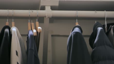 Empty-hanger-being-placed-back-into-closet