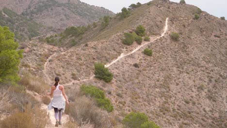 Hikers-group-walk-along-a-rout-in-the-mountain