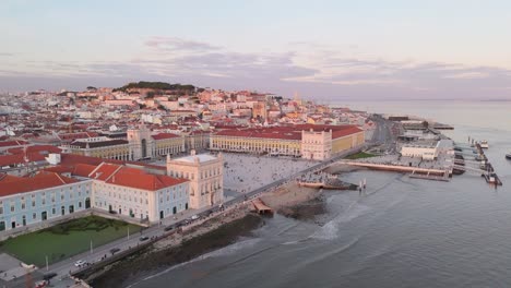 Aerial-dolly-along-Tagus-riverbanks-to-establish-Lisbon-Portugal-welcoming-square