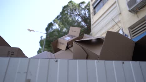 A-pile-of-cardboard-boxes-inside-container-in-the-street