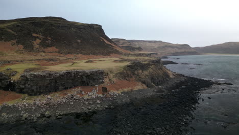 Linear-Lateral-Aerial-View-of-Rocky-Coastline-Near-the-Ocean