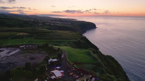 Twilight-aerial-hyperlapse-over-Vigia-das-Baleias-viewpoint-with-coastline-view