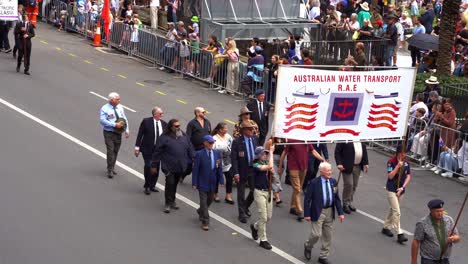 Representatives-from-the-Australian-Water-Transport-Association-walking-down-the-street-of-Brisbane-city,-participating-in-the-annual-Anzac-Day-parade-tradition