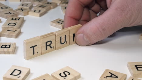 Closeup-narrow-focus:-Name-TRUMP-made-on-table-top-with-Scrabble-tiles