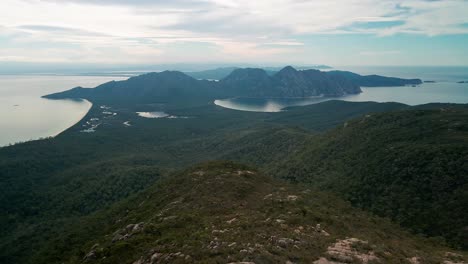 Aerial-profile-view-of-range-of-hills-in-Freycinet-National-Park-in-Tasmania,-Australia