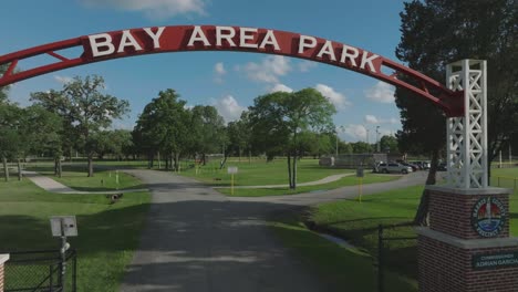 An-aerial-fly-through-of-the-Bay-Area-Park-entrance-sign-on-Bay-Area-Blvd-in-Pasadena,-Texas