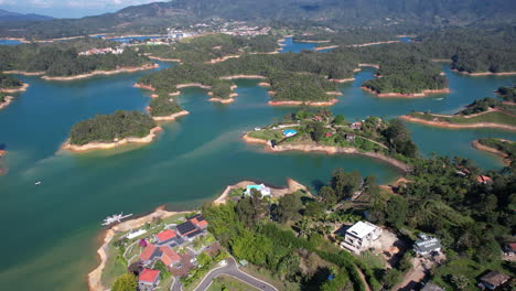 Aerial-View-of-Picturesque-Guatape-Lake,-Colombia-on-Sunny-Summer-Day-Drone-Shot