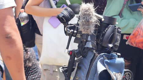 Latin-man-taking-a-photo-of-the-solar-eclipse-from-a-telescope-on-a-tripod,-Mexico-April-8,-2024