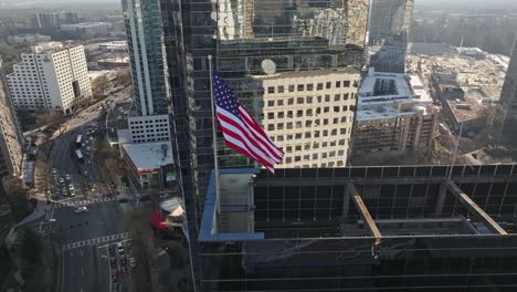 American-Flag-Waving-In-The-Wind-On-The-Rooftop-Of-PulteGroup-Building-In-Atlanta,-Georgia,-USA