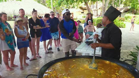 Chef-doing-cooking-demonstration,-making-Payaya-at-Impressive-Resort-and-Spa-in-Punta-Cana,-Dominican-Republic