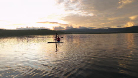 Couple-On-Paddle-Board-And-Kayak-In-Moso-Island-At-Sunrise-In-Vanuatu---Drone-Shot