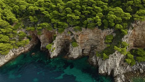 Adriatic-Sea,-Croatia---The-Breathtaking-Steep-Rugged-Cliffs-of-Kalamota-Island---Aerial-Drone-Shot