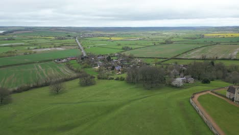 Forward-drone-shot-of-landscape-beside-Rockingham-Castle-in-Northamptonshire,-England