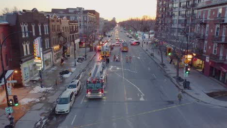 Twilight-descends-on-Montréal,-with-firetrucks-lining-urban-street