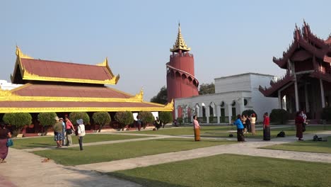 Burmese-tourists-taking-picture-in-the-Nandawun-Park-in-Mandalay,-Myanmar