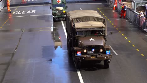 Historic-military-vehicle-driving-down-the-street-during-the-annual-Anzac-Day-parade-tradition-at-Brisbane-city