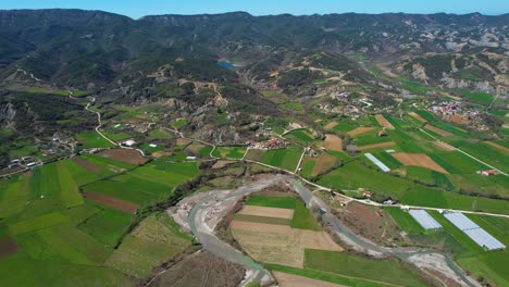 River-Meanders-Through-Verdant-Agricultural-Lands-Surrounding-the-Village-in-the-Beautiful-Valley-in-Albania