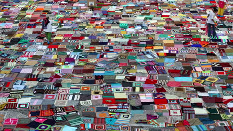 Milan,-Italy---october-2-2021--thousands-of-colorful-crochet-blankets-cover-the-square