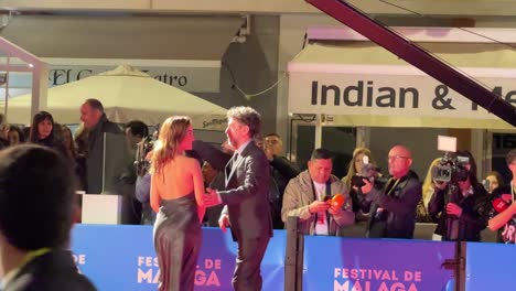 Celebrities-at-Malaga-film-festival-Spain-at-night-with-host-and-Paparazzi