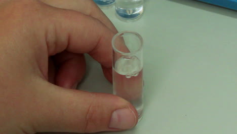 Scientist-using-a-pipette-to-draw-liquid-in-the-laboratory