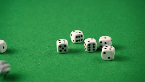 Throwing-regular-D6-dices-on-a-green-game-table