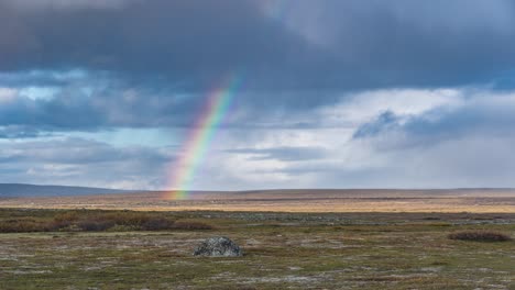 A-rainbow-above-the-stark-nordic-landscape