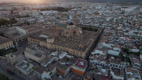 backward-aerial-view-of-mosque-cathedral,-cordoba,-Spain-during-dusk