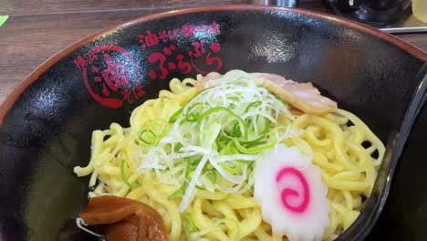 Close-up-shot-of-ramen-dish-in-japanese-fast-food-restaurant-smoking-noodles-dish-closeup