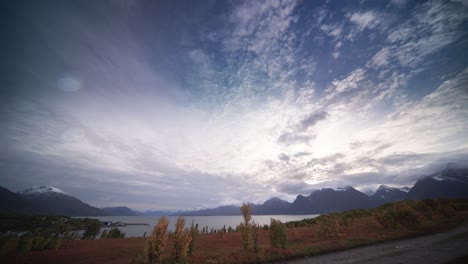 Snow-capped-mountains-tower-above-the-autumn-tundra-valley-on-the-shore-of-the-fjord