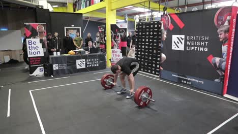 Male-athlete-failing-a-clean-and-jerk-in-slow-motion