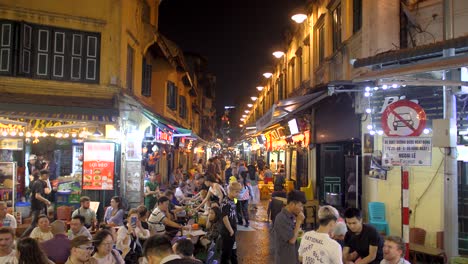 City-adult-nightlife,-restaurants-busy-with-tourists-and-visitors