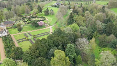 Rotating-drone-shot-of-Rockingham-Castle-with-greenery-all-around-it-in-Northamptonshire-,-England