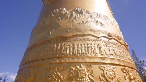 Tourists-And-Locals-Pushing-To-Spin-Giant-Prayer-Wheel-At-Dukezong-Temple-in-Shangri-La,-Yunnan,-China