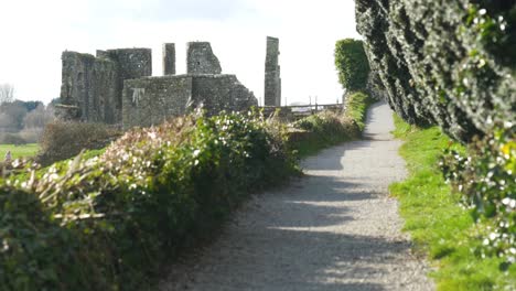 A-Walkway-Towards-Ruins-Of-The-St-Peter-And-Paul-Cathedral-In-Trim,-Meath,-Ireland