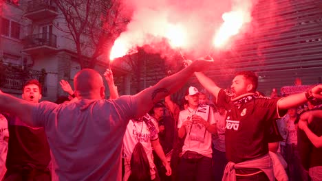 Real-Madrid-fans-light-red-flares-as-they-attend-the-Champions-League-football-match-against-the-British-football-team-Manchester-City-at-Real-Madrid´s-Santiago-Bernabeu-stadium