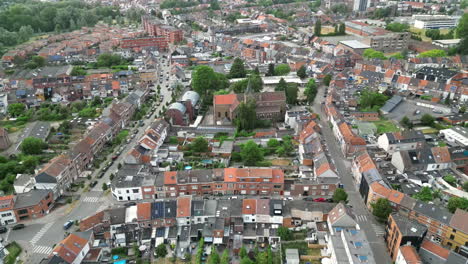 Upward-Aerial-View-of-Ghent-Cityscape-With-Numerous-Buildings-and-Church