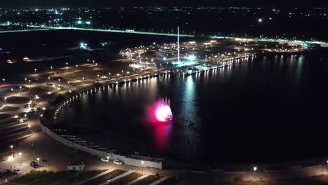 ESTABLISHING-SHOTS-Drone-Camera-is-moving-to-the-side-where-the-big-fountain-show-is-taking-place-and-the-big-Ashoka-pillar-is-visible-in-the-background