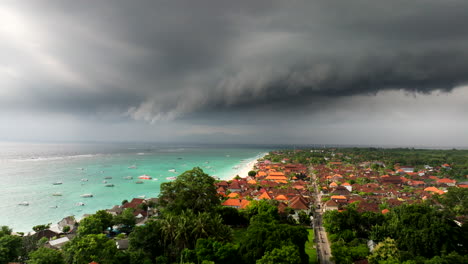 
Stormy-dark-clouds-over-turquoise-colored-ocean-water-of-Nusa-Lembongan-in-Indonesia-with-boats-moored