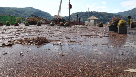 Como,-Italy---august-5-2021---excavator-cleans---Lake-Como-overflows-into-the-city-center-due-to-the-heavy-rains-that-have-hit-the-area-these-days