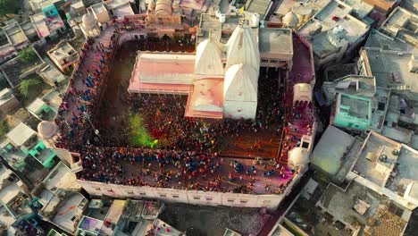 Holi-playing-program-is-about-to-start-and-tourist-are-coming-to-play-Dhuleti-inside-the-temple-and-many-tourist-are-going-outside-after-darshan-Solar-and-network-towers-around-the-temple