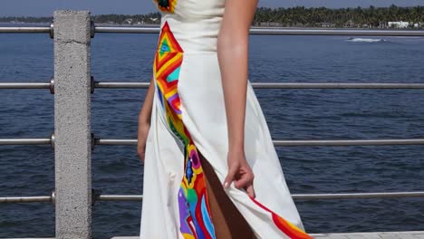 Mexican-girl-models-beach-dress-painting-with-colorful-Huichol-Art-designs