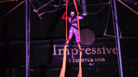 Acrobat-performs-on-ribbon-hig-above-the-floor-at-Circus-Show,-at-Impressive-Resort-and-Spa-at-Punta-Cana,-Dominican-Republic