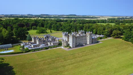 Aerial-View-by-Drone-of-Scottish-Landmark-Floors-Castle-and-Garden-in-Scottish-Borders,-Scotland,-United-Kingdom