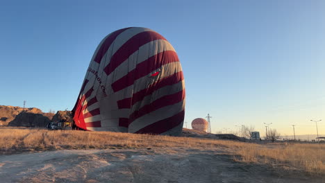 Deflated-Hot-Air-Ballon-Landing-on-Savannah