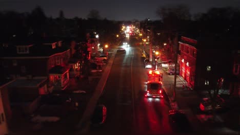 Firefighters-On-Fire-Truck-Arriving-At-Station-At-Night-After-Responding-To-Fire-Incident