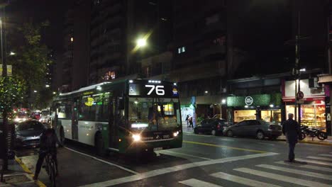 Night-traffic-at-buenos-aires-city-argentina-rivadavia-avenue-people-walking-by-south-american-capital-at-nighttime