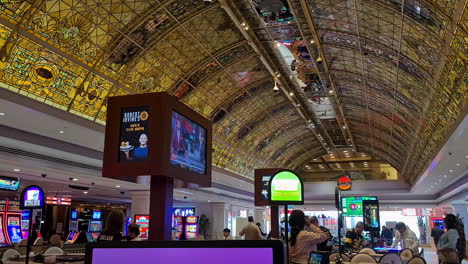 Las-Vegas-USA,-Interior-or-Former-Tropicana-Hotel-Casino-on-Closing-Day,-Gaming-Tables-and-Stained-Glass-Ceiling